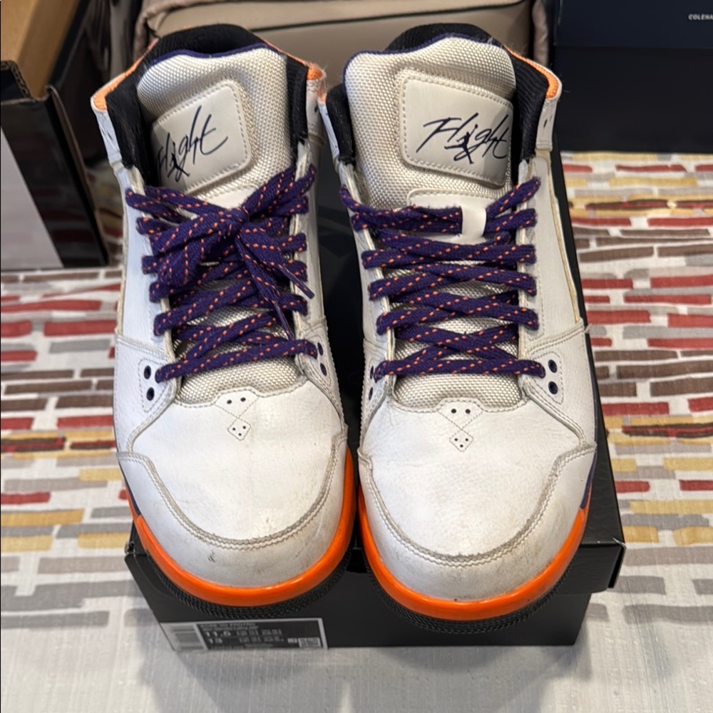 Jordan Sneakers with Purple Laces and Orange Accents